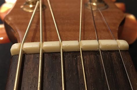 acoustic guitar nut slot height